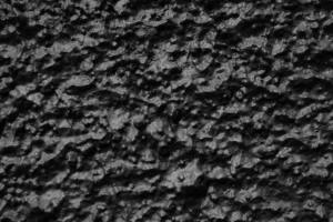Close-up of a textured black surface showing detailed rough patterns.